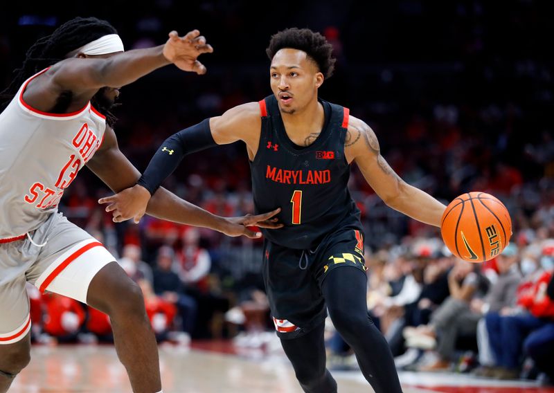 Mar 1, 2023; Columbus, Ohio, USA;  Maryland Terrapins guard Jahmir Young (1) looks to pass as Ohio State Buckeyes guard Isaac Likekele (13) defends during the first half at Value City Arena. Mandatory Credit: Joseph Maiorana-USA TODAY Sports