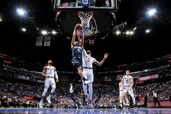 ORLANDO, FL - NOVEMBER 4: Jalen Suggs #4 of the Orlando Magic drives to the basket during the game against the Los Angeles Lakers on November 4, 2023 at Amway Center in Orlando, Florida. NOTE TO USER: User expressly acknowledges and agrees that, by downloading and or using this photograph, User is consenting to the terms and conditions of the Getty Images License Agreement. Mandatory Copyright Notice: Copyright 2023 NBAE (Photo by Fernando Medina/NBAE via Getty Images)