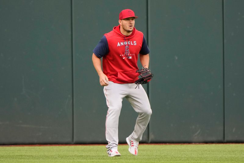 Apr 14, 2022; Arlington, Texas, USA; Los Angeles Angels center fielder Mike Trout (27) warms up during team practice before a baseball game against the Texas Rangers at Globe Life Field. Mandatory Credit: Jim Cowsert-USA TODAY Sports