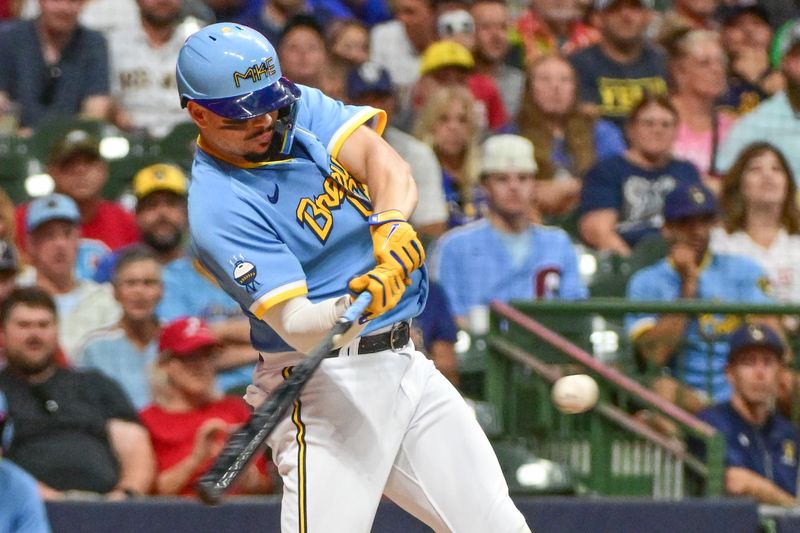 Sep 1, 2023; Milwaukee, Wisconsin, USA; Milwaukee Brewers shortstop Willy Adames (27) hits a three run home run against the Philadelphia Phillies in the fourth inning at American Family Field. Mandatory Credit: Benny Sieu-USA TODAY Sports