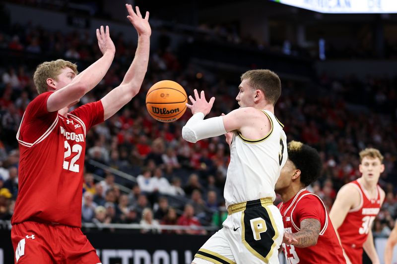 Mar 16, 2024; Minneapolis, MN, USA; Purdue Boilermakers guard Braden Smith (3) passes as Wisconsin Badgers forward Steven Crowl (22) defends during the first half at Target Center. Mandatory Credit: Matt Krohn-USA TODAY Sports