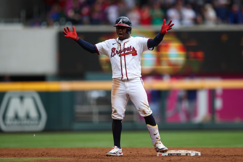 Sep 30, 2024; Atlanta, Georgia, USA; Atlanta Braves second baseman Ozzie Albies (1) celebrates after a three-run double against the New York Mets in the eighth inning at Truist Park. Mandatory Credit: Brett Davis-Imagn Images
