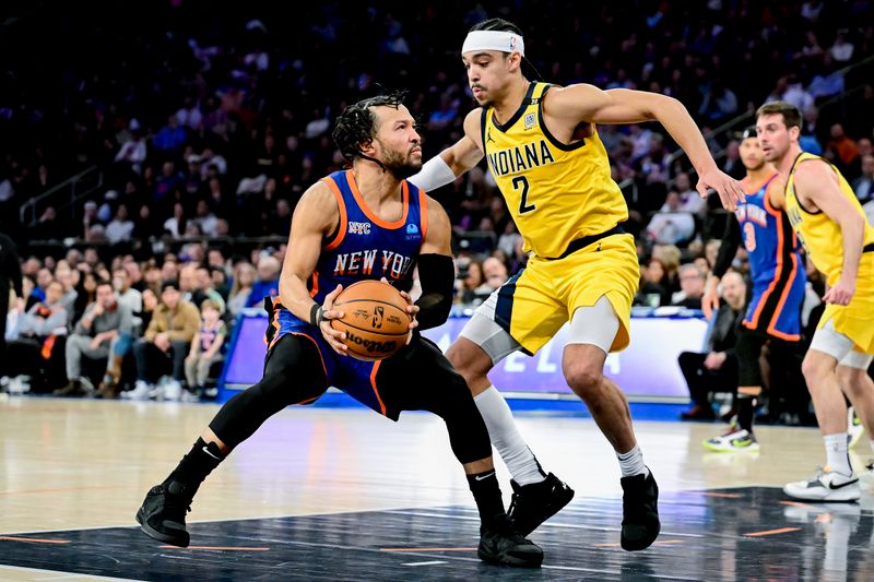 NEW YORK, NEW YORK - FEBRUARY 10:  Jalen Brunson #11 of the New York Knicks drives to the basket against Andrew Nembhard #2 of the Indiana Pacers during the second half at Madison Square Garden on February 10, 2024 in New York City. NOTE TO USER: User expressly acknowledges and agrees that, by downloading and or using this photograph, User is consenting to the terms and conditions of the Getty Images License Agreement. (Photo by Steven Ryan/Getty Images)