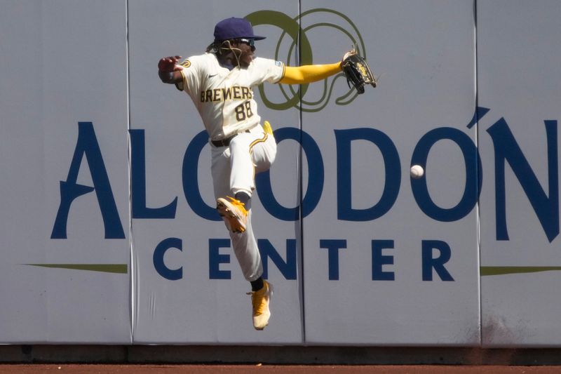 Mar 13, 2024; Phoenix, Arizona, USA; Milwaukee Brewers right fielder Luis Lara (88) jumps for the ball against the Chicago White Sox in the first inning at American Family Fields of Phoenix. Mandatory Credit: Rick Scuteri-USA TODAY Sports