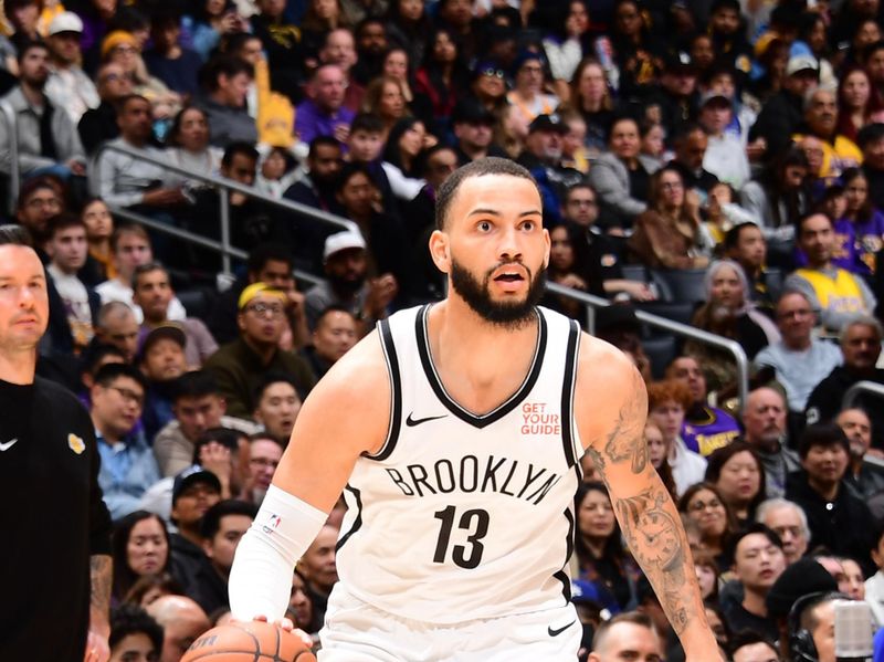 LOS ANGELES, CA - JANUARY 17:  Tyrese Martin #13 of the Brooklyn Nets dribbles the ball during the game against the Los Angeles Lakers on January 17, 2025 at Crypto.Com Arena in Los Angeles, California. NOTE TO USER: User expressly acknowledges and agrees that, by downloading and/or using this Photograph, user is consenting to the terms and conditions of the Getty Images License Agreement. Mandatory Copyright Notice: Copyright 2025 NBAE (Photo by Adam Pantozzi/NBAE via Getty Images)