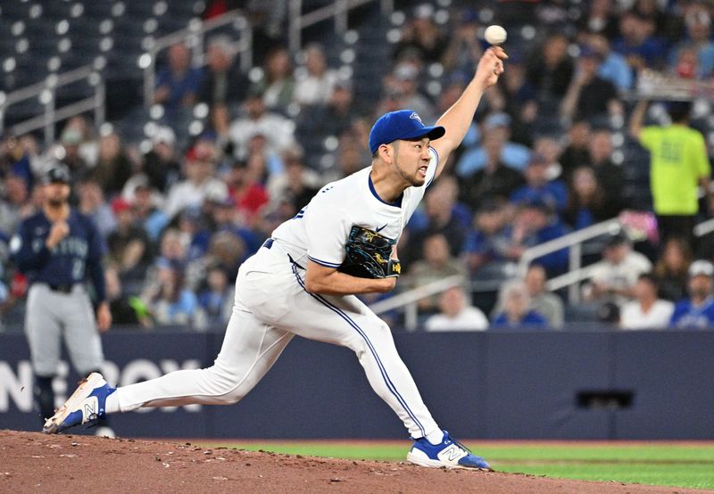 Apr 10, 2024; Toronto, Ontario, CAN;   Toronto Blue Jays starting pitcher Yusei Kikuchi (16) delivers a pitch against the Seattle Mariners in the second inning at Rogers Centre. Mandatory Credit: Dan Hamilton-USA TODAY Sports