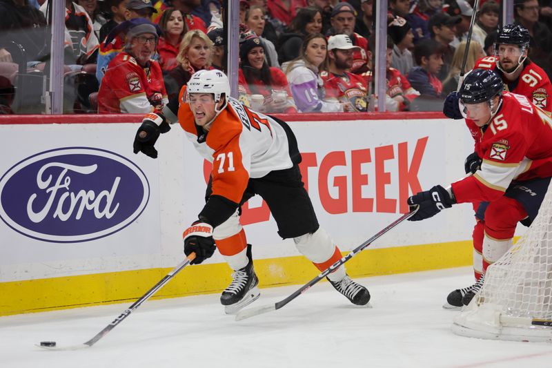 Feb 6, 2024; Sunrise, Florida, USA; Philadelphia Flyers right wing Tyson Foerster (71) reaches for the puck against Florida Panthers center Anton Lundell (15) during the first period at Amerant Bank Arena. Mandatory Credit: Sam Navarro-USA TODAY Sports