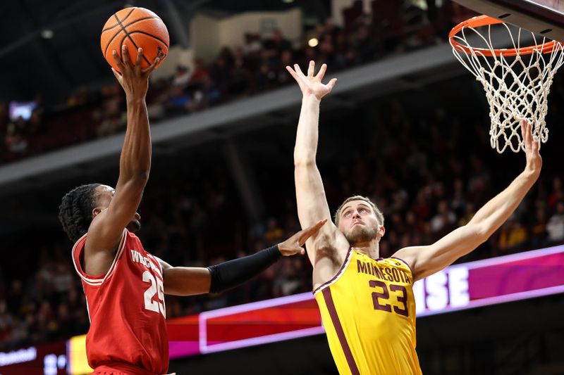 Mar 5, 2025; Minneapolis, Minnesota, USA; Wisconsin Badgers guard John Blackwell (25) shoots as Minnesota Golden Gophers forward Parker Fox (23) defends during the second half at Williams Arena. Mandatory Credit: Matt Krohn-Imagn Images