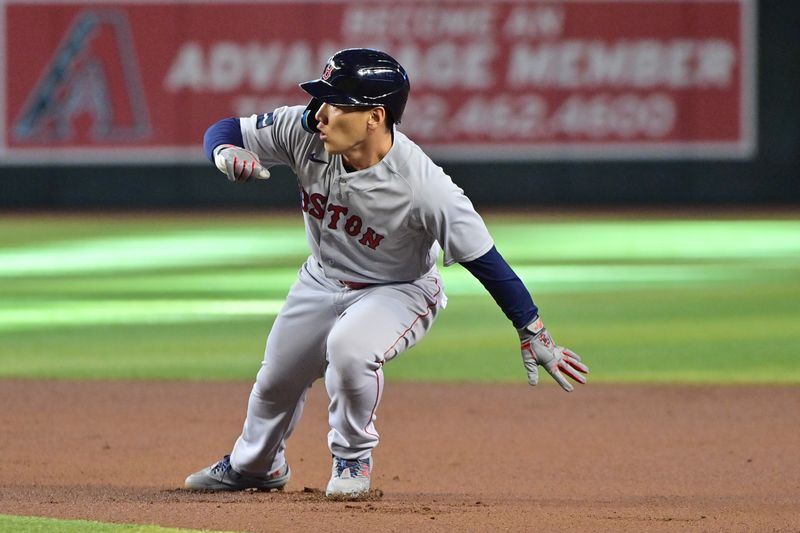 May 27, 2023; Phoenix, Arizona, USA;  Boston Red Sox left fielder Masataka Yoshida (7) reverses direction while running to second base against the Arizona Diamondbacks in the first inning at Chase Field. Mandatory Credit: Matt Kartozian-USA TODAY Sports