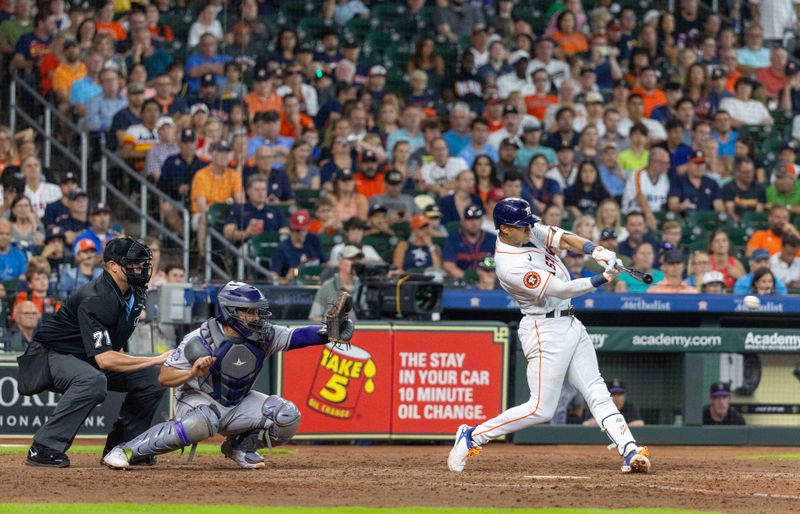 Jul 5, 2023; Houston, Texas, USA; Houston Astros shortstop Jeremy Pena (3) hits a single against the Colorado Rockies in the seventh inning at Minute Maid Park. Mandatory Credit: Thomas Shea-USA TODAY Sports