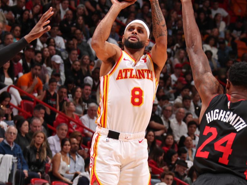 MIAMI, FL - JANUARY 19: Patty Mills #8 of the Atlanta Hawks three point basket during the game against the Miami Heat on January 19, 2024 at Kaseya Center in Miami, Florida. NOTE TO USER: User expressly acknowledges and agrees that, by downloading and or using this Photograph, user is consenting to the terms and conditions of the Getty Images License Agreement. Mandatory Copyright Notice: Copyright 2024 NBAE (Photo by Issac Baldizon/NBAE via Getty Images)