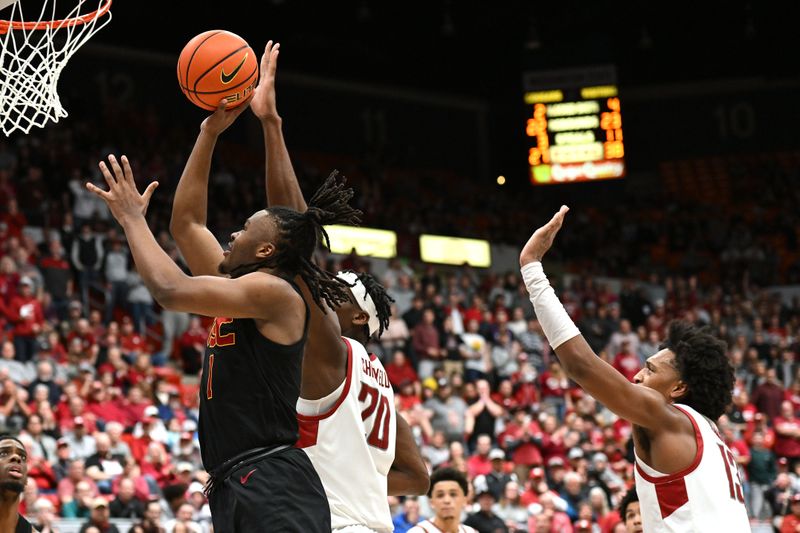 Feb 29, 2024; Pullman, Washington, USA; USC Trojans guard Isaiah Collier (1) shoots the ball against Washington State Cougars center Rueben Chinyelu (20) in the second half at Friel Court at Beasley Coliseum. Washington State Cougars won 75-72. Mandatory Credit: James Snook-USA TODAY Sports