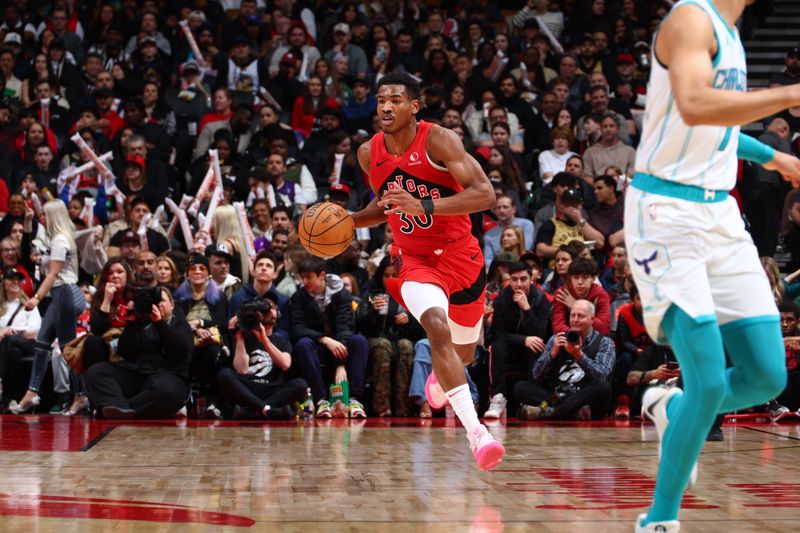 TORONTO, CANADA - MARCH 3: Ochai Agbaji #30 of the Toronto Raptors dribbles the ball during the game against the Charlotte Hornets on March 3, 2024 at the Scotiabank Arena in Toronto, Ontario, Canada.  NOTE TO USER: User expressly acknowledges and agrees that, by downloading and or using this Photograph, user is consenting to the terms and conditions of the Getty Images License Agreement.  Mandatory Copyright Notice: Copyright 2024 NBAE (Photo by Vaughn Ridley/NBAE via Getty Images)