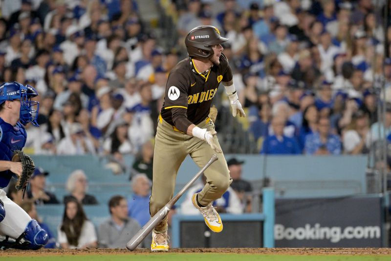 Oct 6, 2024; Los Angeles, California, USA; San Diego Padres outfielder Jackson Merrill (3) runs after hitting an RBI single against the Los Angeles Dodgers in the sixth inning during game two of the NLDS for the 2024 MLB Playoffs at Dodger Stadium. Mandatory Credit: Jayne Kamin-Oncea-Imagn Images