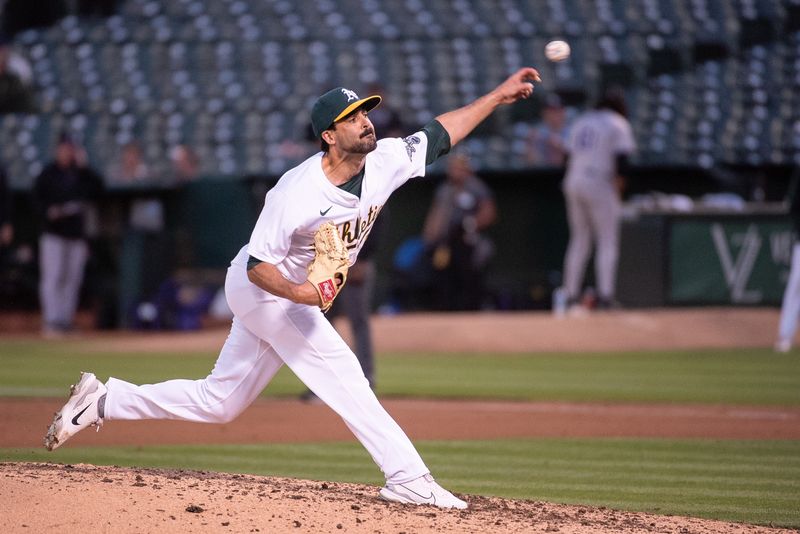 May 21, 2024; Oakland, California, USA; Oakland Athletics relief pitcher Scott Alexander (54) throws a pitch during the seventh inning at Oakland-Alameda County Coliseum. Mandatory Credit: Ed Szczepanski-USA TODAY Sports