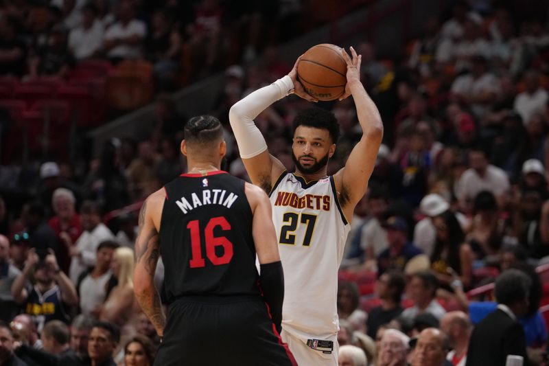 MIAMI, FL - MARCH 13: Jamal Murray #27 of the Denver Nuggets handles the ball during the game against the Miami Heat  on March 13, 2024 at Kaseya Center in Miami, Florida. NOTE TO USER: User expressly acknowledges and agrees that, by downloading and or using this Photograph, user is consenting to the terms and conditions of the Getty Images License Agreement. Mandatory Copyright Notice: Copyright 2024 NBAE (Photo by Eric Espada/NBAE via Getty Images)