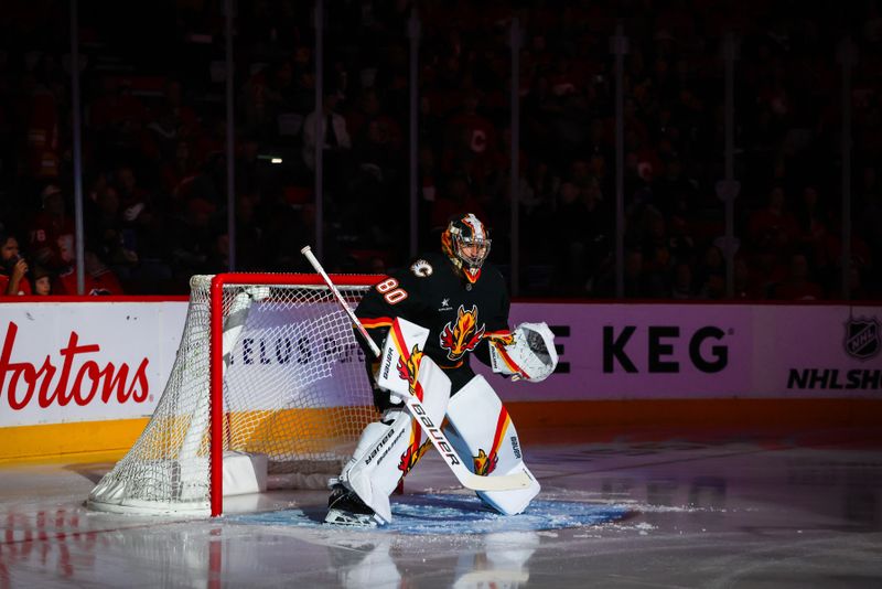 Oct 24, 2024; Calgary, Alberta, CAN; Calgary Flames goaltender Dan Vladar (80) takes the ice prior to the game against the Carolina Hurricanes at Scotiabank Saddledome. Mandatory Credit: Sergei Belski-Imagn Images