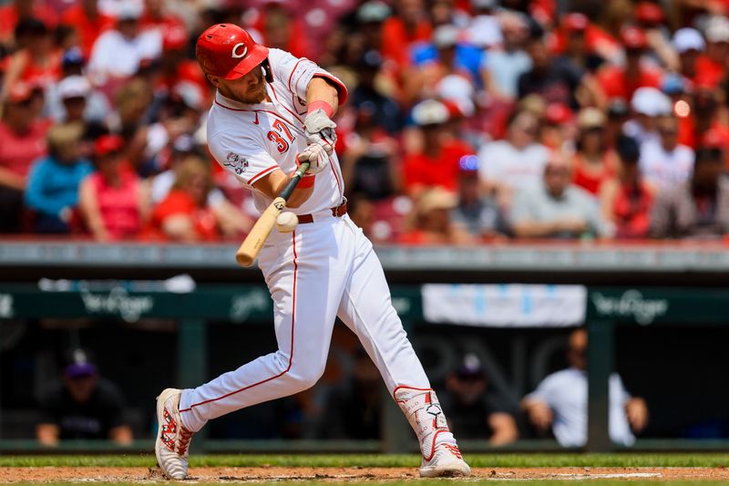 Jul 11, 2024; Cincinnati, Ohio, USA; Cincinnati Reds designated hitter Tyler Stephenson (37) hits a three-run home run in the third inning against the Colorado Rockies at Great American Ball Park. Mandatory Credit: Katie Stratman-USA TODAY Sports