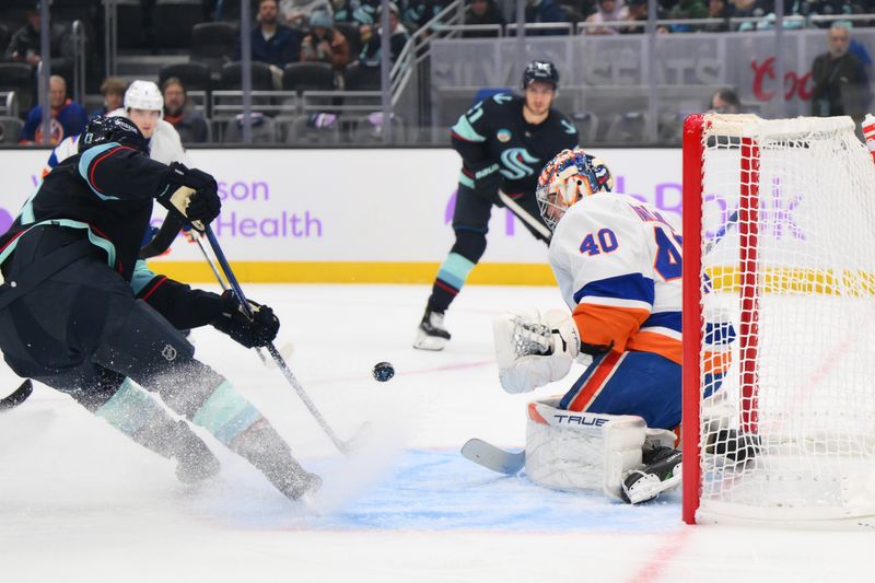 Nov 16, 2023; Seattle, Washington, USA; New York Islanders goaltender Semyon Varlamov (40) blocks a goal shot from Seattle Kraken left wing Brandon Tanev (13) during the first period at Climate Pledge Arena. Mandatory Credit: Steven Bisig-USA TODAY Sports