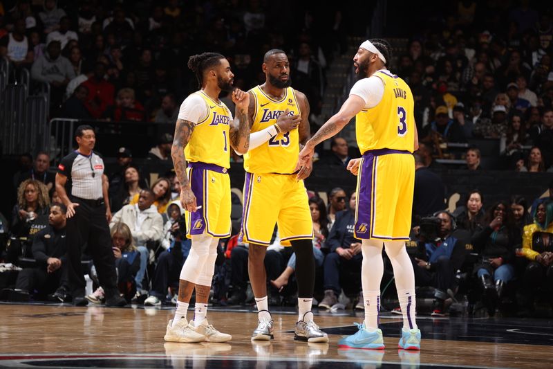 WASHINGTON, DC -? APRIL 3: Anthony Davis #3 of the Los Angeles Lakers talks with D'Angelo Russell #1 and LeBron James #23 during the game against the Washington Wizards on April 3, 2024 at Capital One Arena in Washington, DC. NOTE TO USER: User expressly acknowledges and agrees that, by downloading and or using this Photograph, user is consenting to the terms and conditions of the Getty Images License Agreement. Mandatory Copyright Notice: Copyright 2024 NBAE (Photo by Stephen Gosling/NBAE via Getty Images)