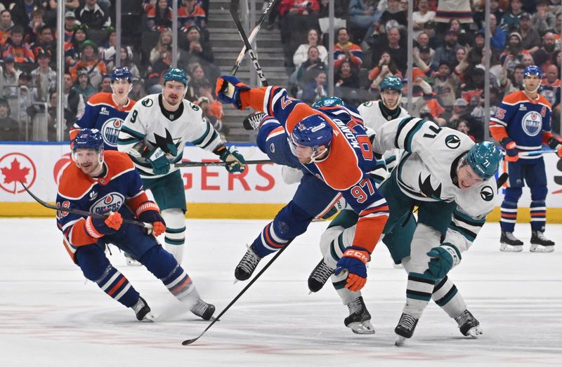 Mar 17, 2026; Edmonton, Alberta, CAN; Edmonton Oilers center Connor McDavid (97) collides with San Jose Sharks center Macklin Celebrini (71) during the third period at Rogers Place. Mandatory Credit: Walter Tychnowicz-Imagn Images