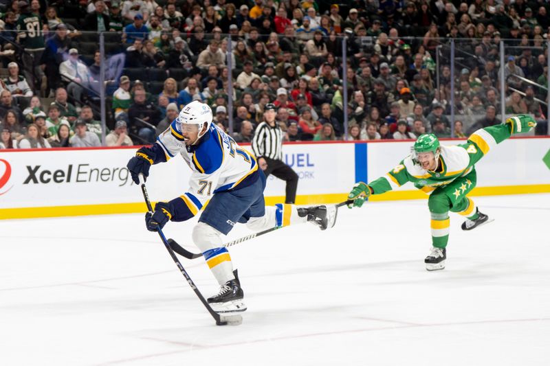 Mar 15, 2025; Saint Paul, Minnesota, USA; St. Louis Blues right wing Mathieu Joseph (71) cannot get a clean shot off due to the defense of Minnesota Wild defenseman Jon Merrill (4) in the third period at Xcel Energy Center. Mandatory Credit: Matt Blewett-Imagn Images