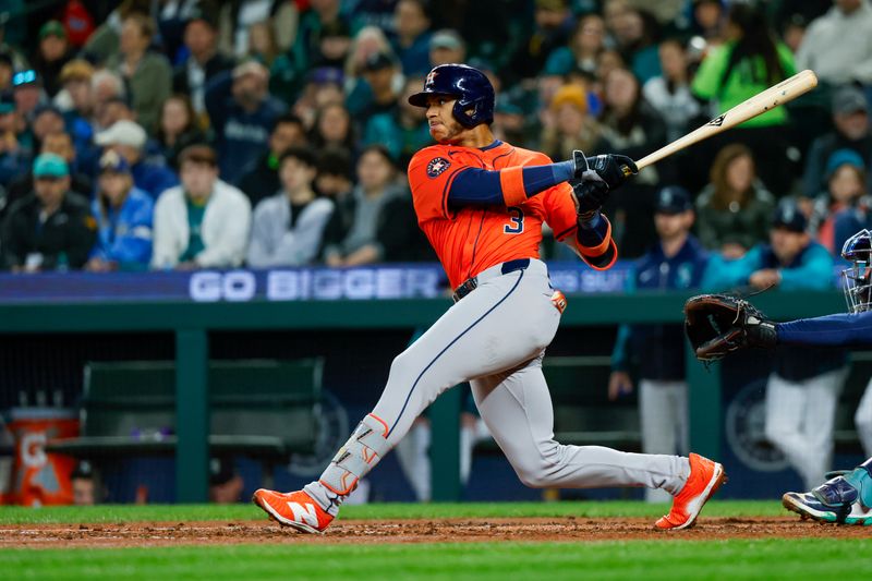 Apr 8, 2025; Seattle, Washington, USA; Houston Astros shortstop Jeremy Peña (3) hits a single against the Seattle Mariners during the fourth inning at T-Mobile Park. Mandatory Credit: Joe Nicholson-Imagn Images