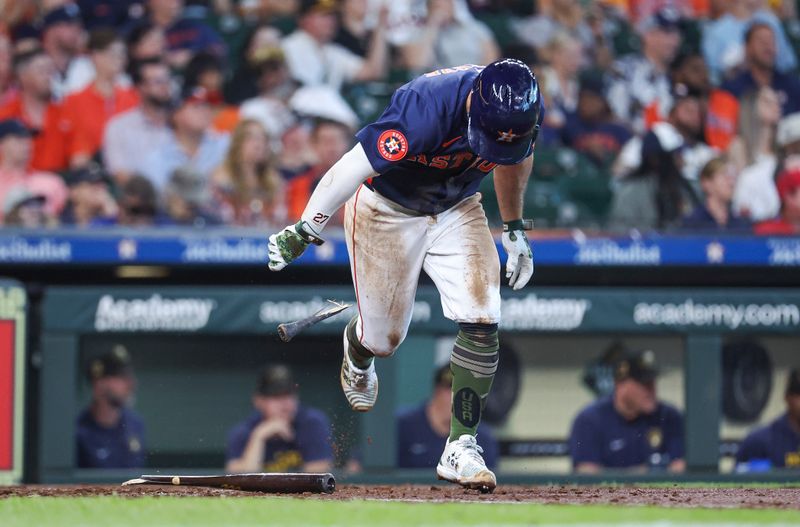 May 19, 2024; Houston, Texas, USA; Houston Astros second baseman Jose Altuve (27) drops his broken bat on a play during the fourth inning against the Milwaukee Brewers at Minute Maid Park. Mandatory Credit: Troy Taormina-USA TODAY Sports