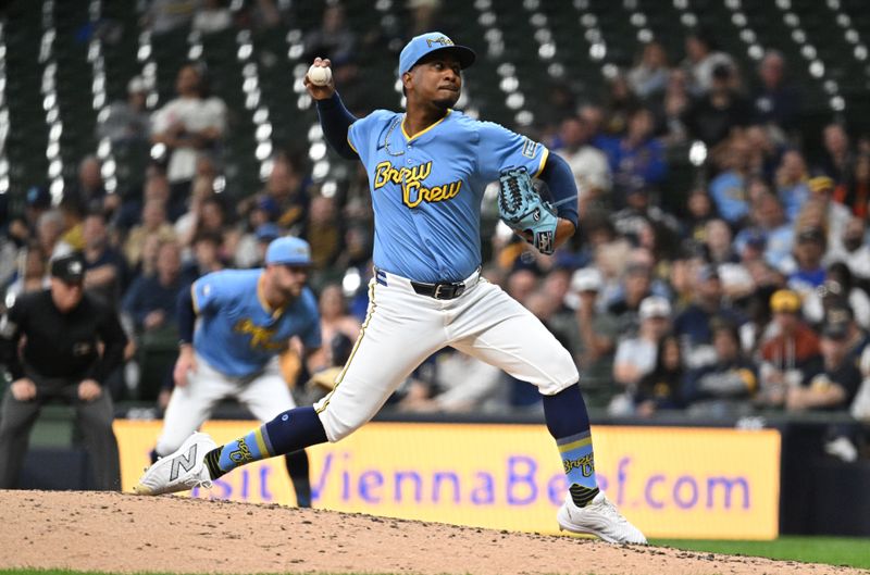 Jun 11, 2024; Milwaukee, Wisconsin, USA; Milwaukee Brewers starting pitcher Carlos Rodriguez (00) delivers a pitch against the Toronto Blue Jays in the third inning at American Family Field. Mandatory Credit: Michael McLoone-USA TODAY Sports