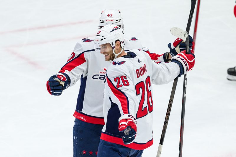 Dec 10, 2023; Chicago, Illinois, USA; Washington Capitals center Nic Dowd (26) celebrates his goal against the Chicago Blackhawks during the third period at the United Center. Mandatory Credit: Daniel Bartel-USA TODAY Sports