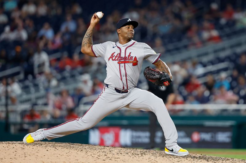 Jun 6, 2024; Washington, District of Columbia, USA; Atlanta Braves relief pitcher Raisel Iglesias (26) pitches against the Washington Nationals during the ninth inning at Nationals Park. Mandatory Credit: Geoff Burke-USA TODAY Sports