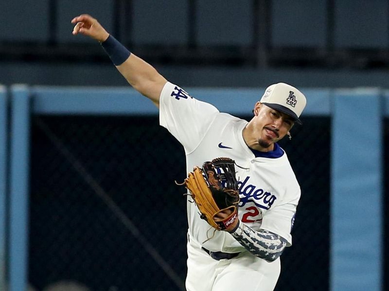 Jul 4, 2024; Los Angeles, California, USA; Los Angeles Dodgers outfielder Miguel Vargas (27) throws home during the ninth inning against the Arizona Diamondbacks at Dodger Stadium. Mandatory Credit: Jason Parkhurst-USA TODAY Sports