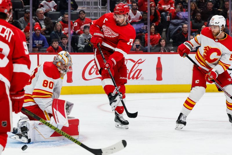 Oct 22, 2023; Detroit, Michigan, USA;  Calgary Flames goaltender Dan Vladar (80) makes the save on Detroit Red Wings center Dylan Larkin (71) in the second period at Little Caesars Arena. Mandatory Credit: Rick Osentoski-USA TODAY Sports