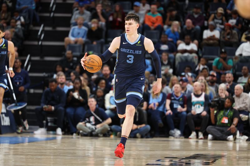 MEMPHIS, TENNESSEE - OCTOBER 31: Jake LaRavia #3 of the Memphis Grizzlies dribbles the ball up the court against the Milwaukee Bucks during the second half at FedExForum on October 31, 2024 in Memphis, Tennessee. NOTE TO USER: User expressly acknowledges and agrees that, by downloading and or using this Photograph, user is consenting to the terms and conditions of the Getty Images License Agreement. (Photo by Wes Hale/Getty Images)