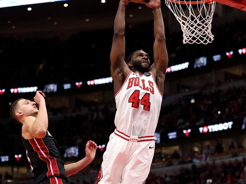 CHICAGO, ILLINOIS - FEBRUARY 04: Patrick Williams #44 of the Chicago Bulls dunks the ball over Nikola Jovic #5 of the Miami Heat during the fourth quarter at the United Center on February 04, 2025 in Chicago, Illinois. NOTE TO USER: User expressly acknowledges and agrees that, by downloading and or using this photograph, user is consenting to the terms and conditions of the Getty Images License Agreement.  (Photo by Luke Hales/Getty Images)