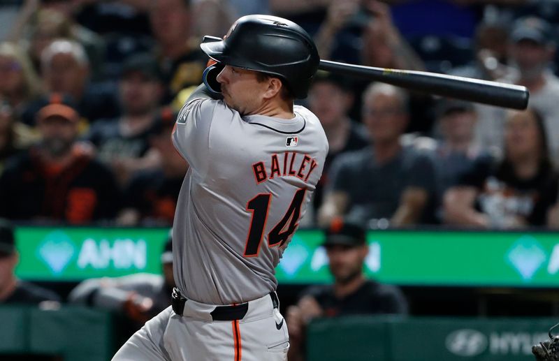 May 22, 2024; Pittsburgh, Pennsylvania, USA; San Francisco Giants catcher Patrick Bailey (14) hits an RBI single against the Pittsburgh Pirates during the tenth inning at PNC Park. Mandatory Credit: Charles LeClaire-USA TODAY Sports