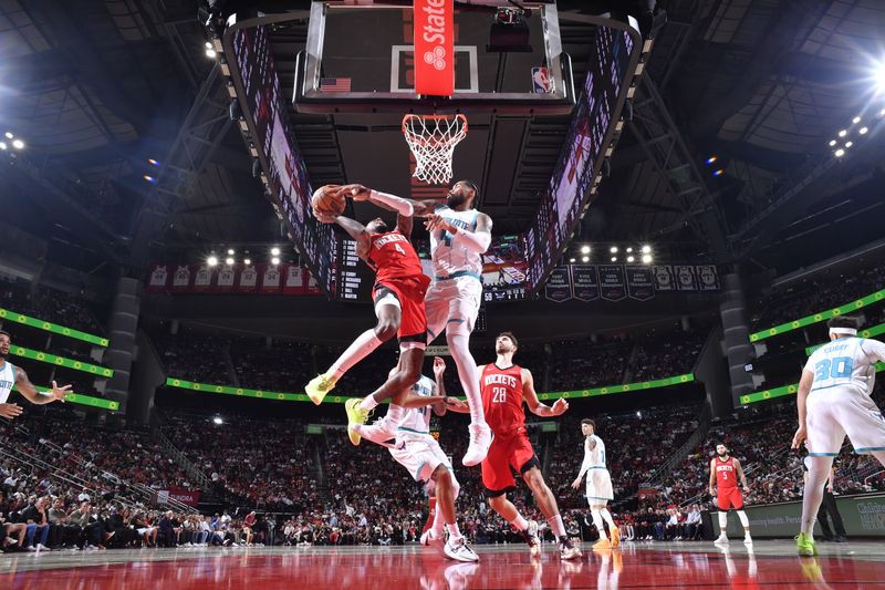 HOUSTON, TX - OCTOBER 23:  Nick Richards #4 of the Charlotte Hornets =blocks shot against the Houston Rockets during a regular season game on October 23, 2024 at the Toyota Center in Houston, Texas. NOTE TO USER: User expressly acknowledges and agrees that, by downloading and or using this photograph, User is consenting to the terms and conditions of the Getty Images License Agreement. Mandatory Copyright Notice: Copyright 2024 NBAE (Photo by Logan Riely/NBAE via Getty Images)