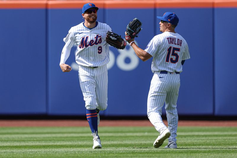 Apr 20, 2025; New York City, New York, USA; New York Mets left fielder Brandon Nimmo (9) celebrates with right fielder Tyrone Taylor (15) after making a catch to save a home run hit by St. Louis Cardinals right fielder Jordan Walker (not pictured) during the sixth inning at Citi Field. Mandatory Credit: Vincent Carchietta-Imagn Images