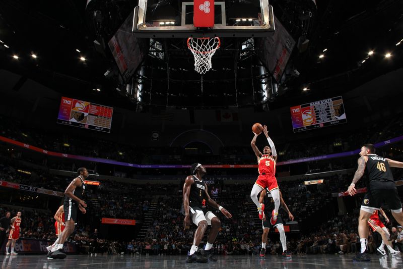 MEMPHIS, TN - MARCH 8: Dejounte Murray #5 of the Atlanta Hawks drives to the basket during the game against the Memphis Grizzlies on March 8, 2024 at FedExForum in Memphis, Tennessee. NOTE TO USER: User expressly acknowledges and agrees that, by downloading and or using this photograph, User is consenting to the terms and conditions of the Getty Images License Agreement. Mandatory Copyright Notice: Copyright 2024 NBAE (Photo by Joe Murphy/NBAE via Getty Images)