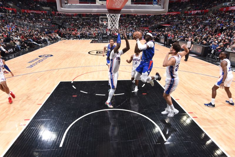 LOS ANGELES, CA - JANUARY 17: Reggie Jackson #1 of the LA Clippers drives to the basket during the game against the Philadelphia 76ers on January 17, 2023 at Crypto.Com Arena in Los Angeles, California. NOTE TO USER: User expressly acknowledges and agrees that, by downloading and/or using this Photograph, user is consenting to the terms and conditions of the Getty Images License Agreement. Mandatory Copyright Notice: Copyright 2023 NBAE (Photo by Adam Pantozzi/NBAE via Getty Images)