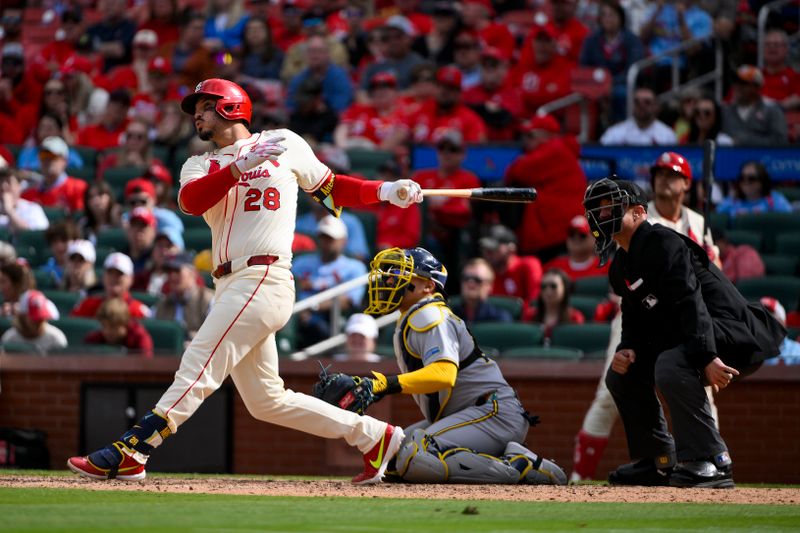Apr 26, 2025; St. Louis, Missouri, USA;  St. Louis Cardinals third baseman Nolan Arenado (28) hits a solo walk-off home run against the Milwaukee Brewers during the ninth inning at Busch Stadium. Mandatory Credit: Jeff Curry-Imagn Images