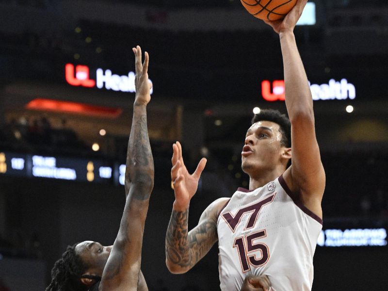 Mar 5, 2024; Louisville, Kentucky, USA; Virginia Tech Hokies center Lynn Kidd (15) shoots against Louisville Cardinals guard Mike James (0) during the first half at KFC Yum! Center. Mandatory Credit: Jamie Rhodes-USA TODAY Sports