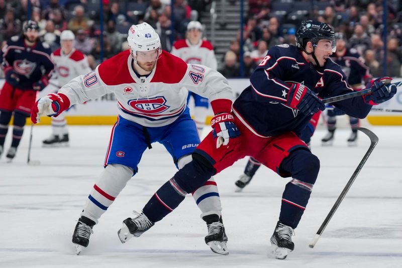 Nov 29, 2023; Columbus, Ohio, USA;  Montreal Canadiens right wing Joel Armia (40) loses his puck as he skates against Columbus Blue Jackets defenseman Zach Werenski (8) in the third period at Nationwide Arena. Mandatory Credit: Aaron Doster-USA TODAY Sports