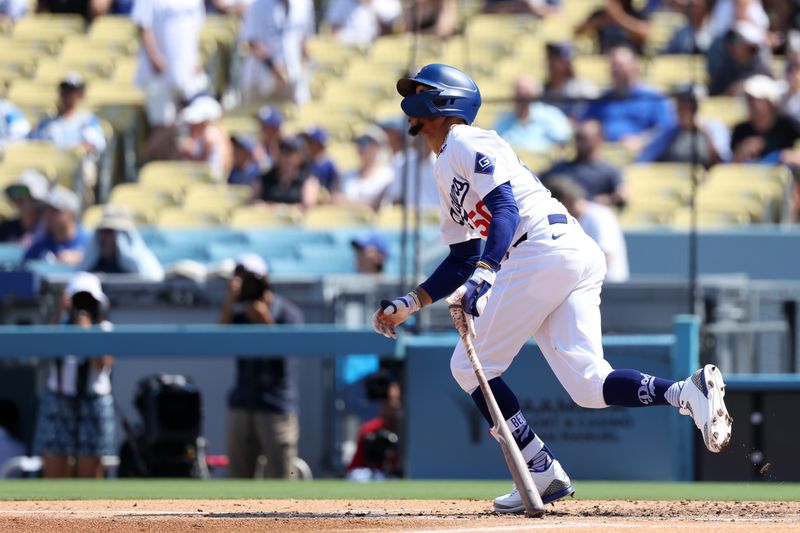 Sep 8, 2024; Los Angeles, California, USA;  Los Angeles Dodgers right fielder Mookie Betts (50) hits a triple during the fourth inning against the Cleveland Guardians at Dodger Stadium. Mandatory Credit: Kiyoshi Mio-Imagn Images