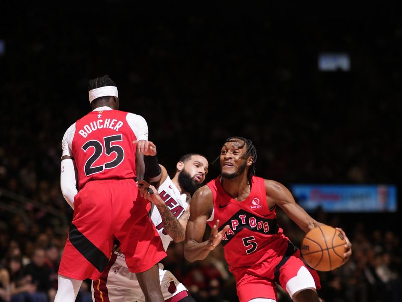 TORONTO, CANADA - JANUARY 17: Immanuel Quickley #5 of the Toronto Raptors dribbles the ball during the game against the Miami Heat on January 17, 2024 at the Scotiabank Arena in Toronto, Ontario, Canada.  NOTE TO USER: User expressly acknowledges and agrees that, by downloading and or using this Photograph, user is consenting to the terms and conditions of the Getty Images License Agreement.  Mandatory Copyright Notice: Copyright 2024 NBAE (Photo by Mark Blinch/NBAE via Getty Images)