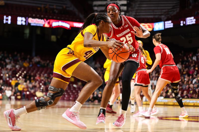 Feb 20, 2024; Minneapolis, Minnesota, USA; Minnesota Golden Gophers forward Niamya Holloway (41) works around Wisconsin Badgers forward Serah Williams (25)  during the first half at Williams Arena. Mandatory Credit: Matt Krohn-USA TODAY Sports