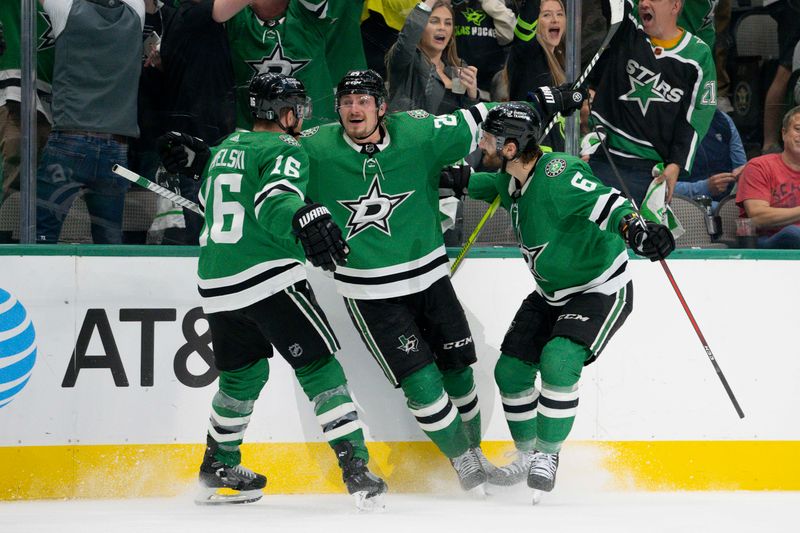 May 15, 2023; Dallas, Texas, USA; Dallas Stars center Roope Hintz (24) and center Joe Pavelski (16) and defenseman Colin Miller (6) celebrates after Hintz scores a goal on a breakaway shot against Seattle Kraken goaltender Philipp Grubauer (not pictured) during the second period in game seven of the second round of the 2023 Stanley Cup Playoffs at the American Airlines Center. Mandatory Credit: Jerome Miron-USA TODAY Sports