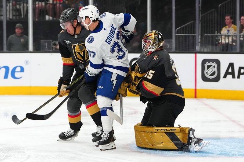 Mar 23, 2025; Las Vegas, Nevada, USA; Vegas Golden Knights defenseman Zach Whitecloud (2) blocks a shot as Tampa Bay Lightning center Yanni Gourde (37) attempts to screen goaltender Ilya Samsonov (35) during the first period at T-Mobile Arena. Mandatory Credit: Stephen R. Sylvanie-Imagn Images