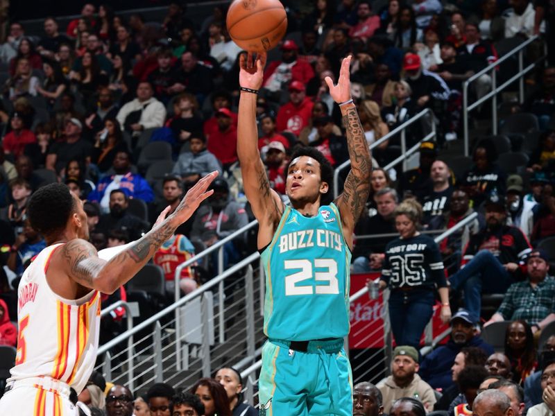 ATLANTA, GA - MARCH 23: Tre Mann #23 of the Charlotte Hornets shoots the ball during the game against the Atlanta Hawks on March 23, 2024 at State Farm Arena in Atlanta, Georgia.  NOTE TO USER: User expressly acknowledges and agrees that, by downloading and/or using this Photograph, user is consenting to the terms and conditions of the Getty Images License Agreement. Mandatory Copyright Notice: Copyright 2024 NBAE (Photo by Scott Cunningham/NBAE via Getty Images)