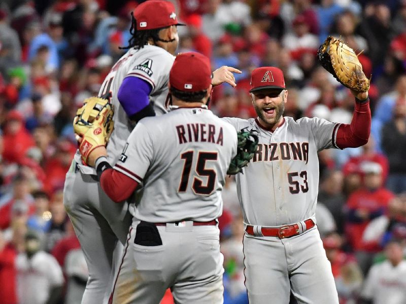 Oct 24, 2023; Philadelphia, Pennsylvania, USA; Arizona Diamondbacks second baseman Ketel Marte (4), third baseman Emmanuel Rivera (15) and first baseman Christian Walker (53) react after defeating the Philadelphia Phillies in game seven of the NLCS for the 2023 MLB playoffs at Citizens Bank Park. Mandatory Credit: Eric Hartline-USA TODAY Sports